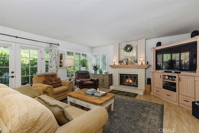 10830 Orchard View Ln, Riverside, CA 92503 - living room featuring plenty of natural light, a brick fireplace, and light wood finished floors