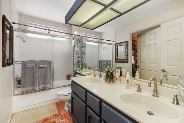 10830 Orchard View Ln, Riverside, CA 92503 - bathroom featuring toilet, shower / bath combination with glass door, tile patterned flooring, and double vanity