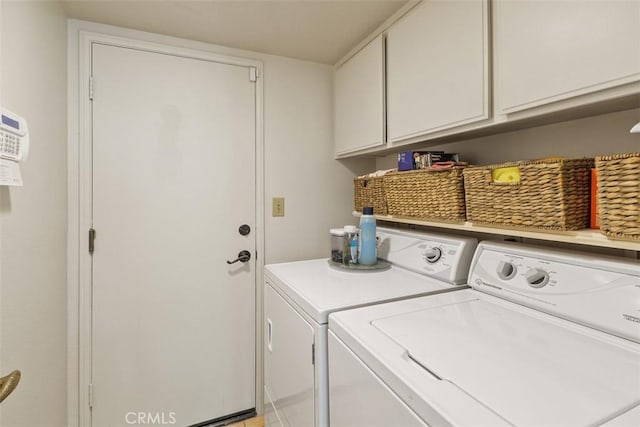 10830 Orchard View Ln, Riverside, CA 92503 - laundry area featuring washer and dryer and cabinet space