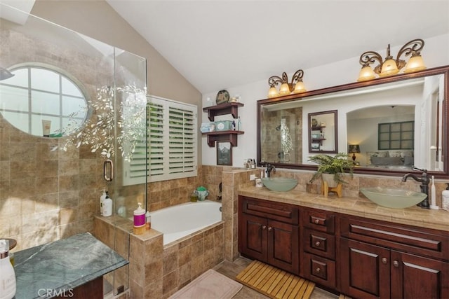10830 Orchard View Ln, Riverside, CA 92503 - ensuite bathroom featuring a bath, double vanity, vaulted ceiling, plenty of natural light, and a stall shower