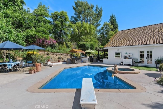 10830 Orchard View Ln, Riverside, CA 92503 - view of swimming pool with french doors, a patio, a diving board, and a pool with connected hot tub
