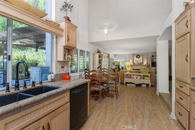 10830 Orchard View Ln, Riverside, CA 92503 - kitchen featuring dishwasher, a sink, tasteful backsplash, light stone countertops, and healthy amount of natural light