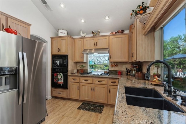 10830 Orchard View Ln, Riverside, CA 92503 - kitchen with black appliances, a sink, under cabinet range hood, light brown cabinetry, and healthy amount of natural light