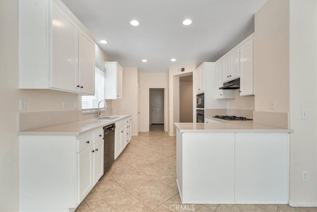 36340 Sicily Ln, Winchester, CA 92596 - kitchen featuring under cabinet range hood, black appliances, recessed lighting, a peninsula, and white cabinets