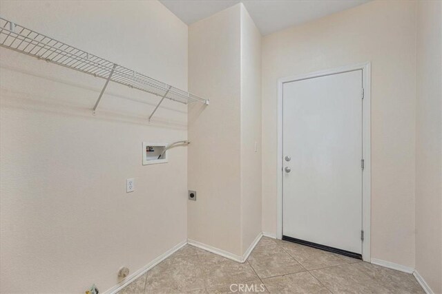 36340 Sicily Ln, Winchester, CA 92596 - laundry area with washer hookup, hookup for an electric dryer, light tile patterned floors, and gas dryer hookup