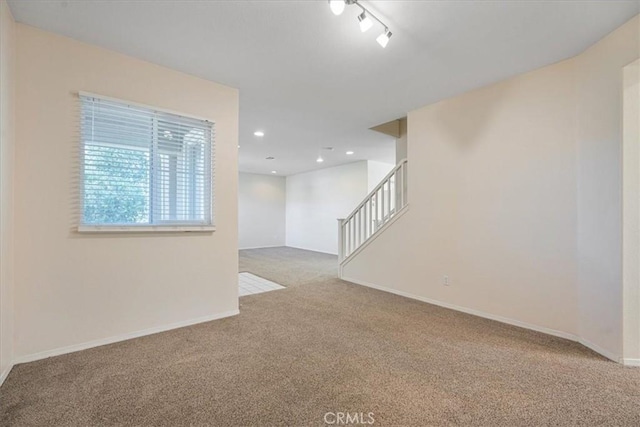 36340 Sicily Ln, Winchester, CA 92596 - empty room featuring carpet flooring, stairway, recessed lighting, and rail lighting