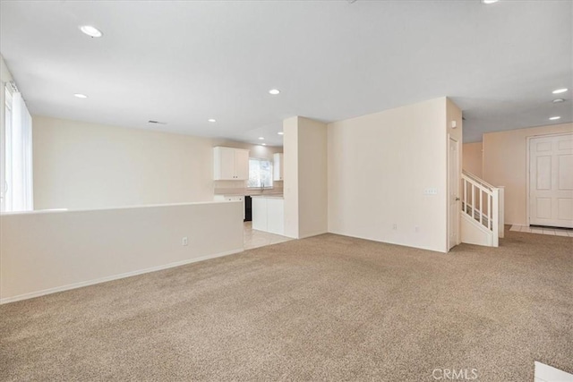 36340 Sicily Ln, Winchester, CA 92596 - unfurnished living room with light carpet, recessed lighting, and stairs