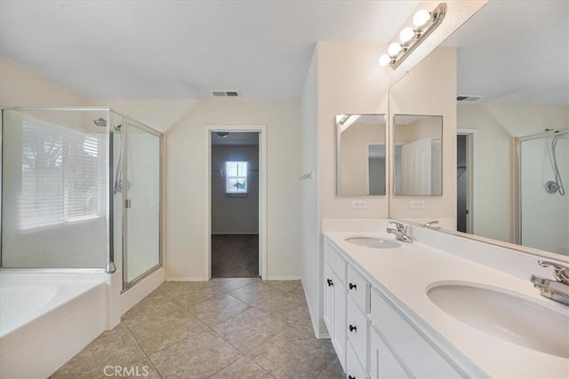 36340 Sicily Ln, Winchester, CA 92596 - full bathroom featuring double vanity, a shower stall, a garden tub, and tile patterned flooring