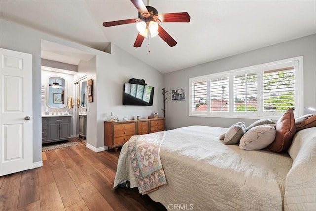 9081 Mandarin Ln, Riverside, CA 92508 - bedroom with lofted ceiling, wood-type flooring, a ceiling fan, baseboards, and connected bathroom