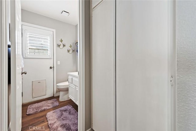 9081 Mandarin Ln, Riverside, CA 92508 - bathroom featuring vanity, wood finished floors, and toilet