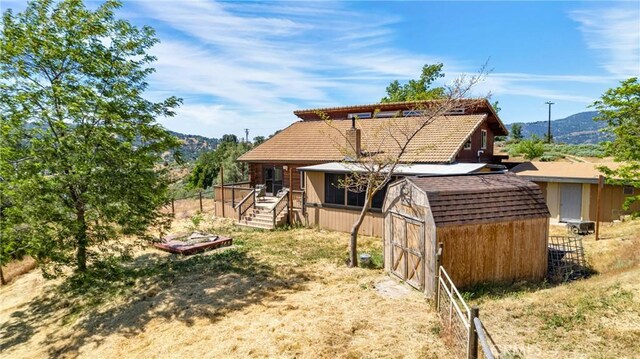 30771 Fox Ridge Ct, Tehachapi, CA 93561 - rear view of house featuring a deck with mountain view