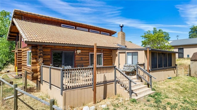 30771 Fox Ridge Ct, Tehachapi, CA 93561 - back of property with a chimney, a wooden deck, and a sunroom