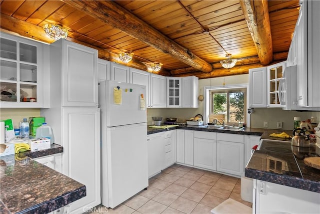 30771 Fox Ridge Ct, Tehachapi, CA 93561 - kitchen featuring white appliances, wood ceiling with exposed beams, light tile patterned flooring, glass insert cabinets, and white cabinetry