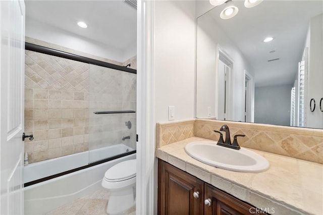 15 Basilica Pl, Ladera Ranch, CA 92694 - bathroom with vanity, toilet, combined bath / shower with glass door, recessed lighting, and decorative backsplash