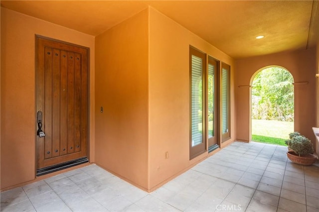 15 Basilica Pl, Ladera Ranch, CA 92694 - doorway to property with stucco siding and a patio area