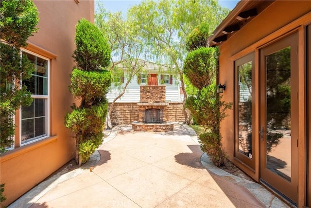 15 Basilica Pl, Ladera Ranch, CA 92694 - view of patio featuring an outdoor stone fireplace