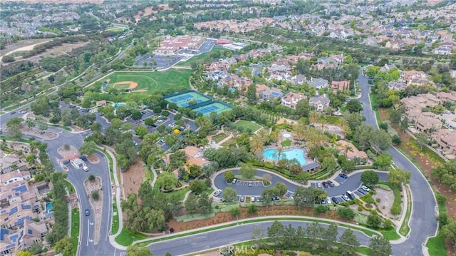 15 Basilica Pl, Ladera Ranch, CA 92694 - aerial overview of property's location featuring a pool and nearby suburban area