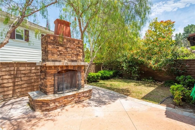 15 Basilica Pl, Ladera Ranch, CA 92694 - view of patio with an outdoor stone fireplace
