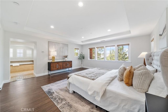 15 Basilica Pl, Ladera Ranch, CA 92694 - bedroom with a tray ceiling, dark wood-style flooring, recessed lighting, and baseboards
