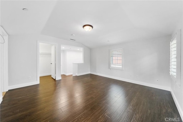 15 Basilica Pl, Ladera Ranch, CA 92694 - unfurnished living room featuring lofted ceiling, wood finished floors, and baseboards