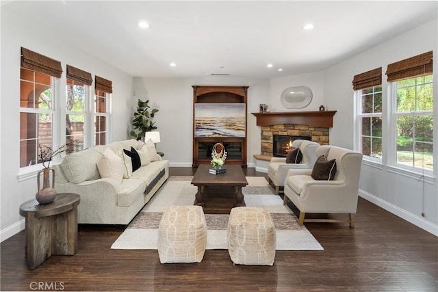 15 Basilica Pl, Ladera Ranch, CA 92694 - living room with baseboards, recessed lighting, a stone fireplace, and wood finished floors