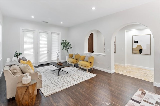 15 Basilica Pl, Ladera Ranch, CA 92694 - living room featuring wood finished floors, recessed lighting, baseboards, and arched walkways