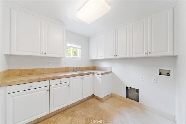 15 Basilica Pl, Ladera Ranch, CA 92694 - laundry room with cabinet space, washer hookup, and baseboards