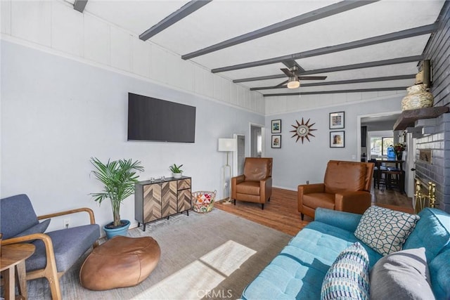 4201 Irvon Trl, Frazier Park, CA 93225 - living room with wood finished floors, a ceiling fan, a fireplace, and beam ceiling