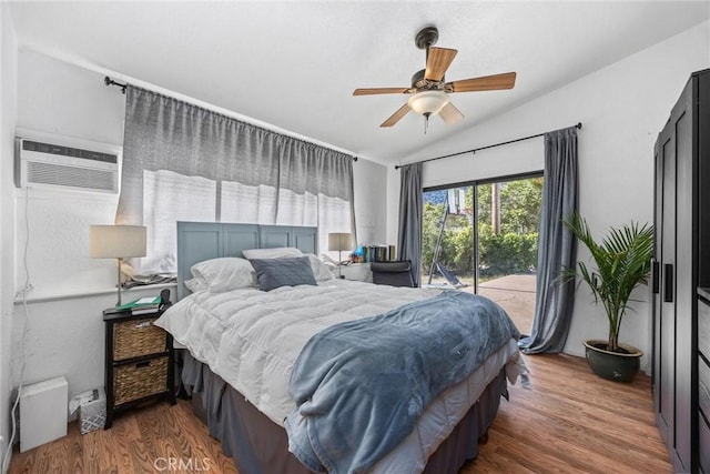 4201 Irvon Trl, Frazier Park, CA 93225 - bedroom with lofted ceiling, a wall unit AC, access to outside, wood finished floors, and a ceiling fan