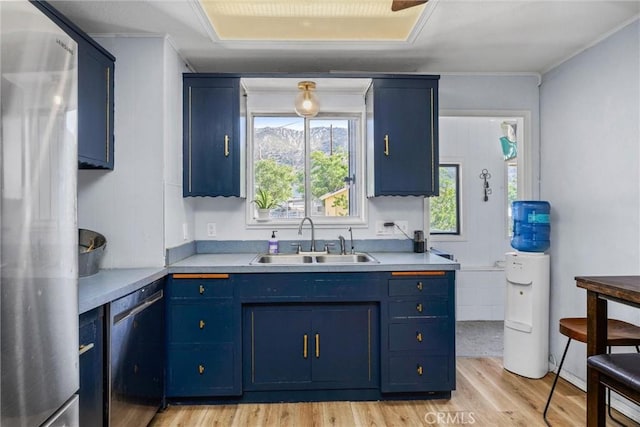 4201 Irvon Trl, Frazier Park, CA 93225 - kitchen with a sink, stainless steel appliances, blue cabinets, light wood finished floors, and light countertops