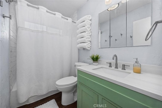4201 Irvon Trl, Frazier Park, CA 93225 - bathroom featuring wood finished floors, vanity, toilet, and shower / bath combo with shower curtain