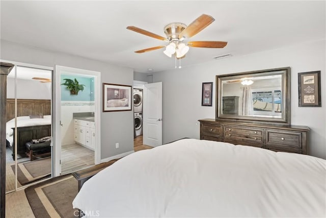 234 N Alta Vista Ave, Monrovia, CA 91016 - bedroom with estacked washer and dryer, a ceiling fan, and wood finished floors