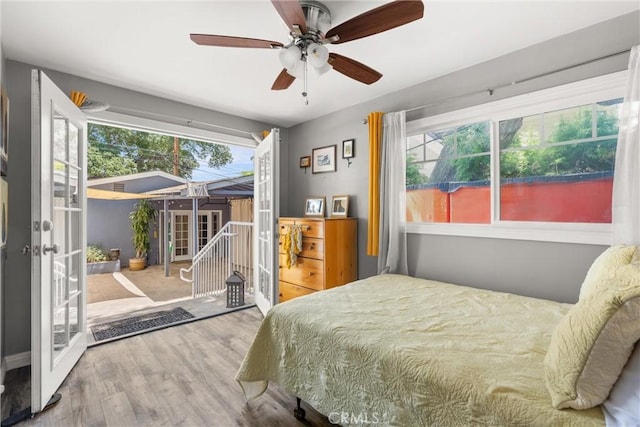 234 N Alta Vista Ave, Monrovia, CA 91016 - bedroom featuring access to exterior, french doors, wood finished floors, and ceiling fan
