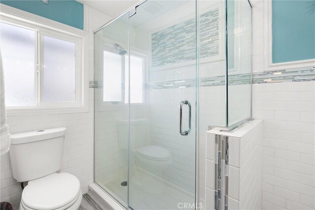 234 N Alta Vista Ave, Monrovia, CA 91016 - bathroom with tile walls, healthy amount of natural light, and a shower stall
