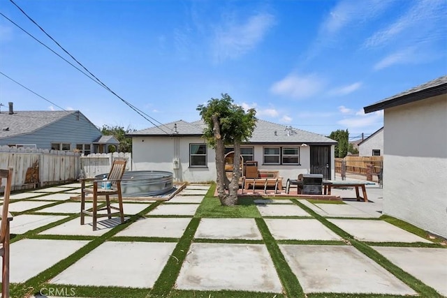 112 W Grandview Dr, Barstow, CA 92311 - back of property with a patio, an outdoor hot tub, and a fenced backyard