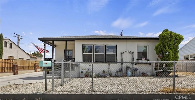112 W Grandview Dr, Barstow, CA 92311 - view of front of home with stucco siding and a fenced front yard