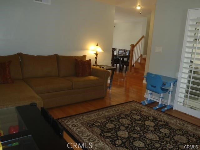 11459 Shippigan Way, Cypress, CA 90630 - living area with wood finished floors and stairway