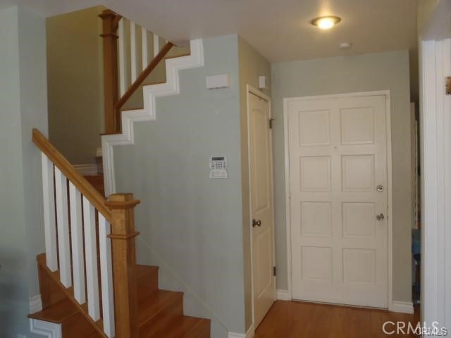 11459 Shippigan Way, Cypress, CA 90630 - stairs featuring baseboards and wood finished floors