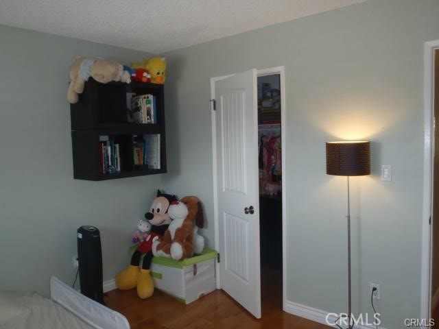 11459 Shippigan Way, Cypress, CA 90630 - bedroom with wood finished floors, baseboards, and a closet