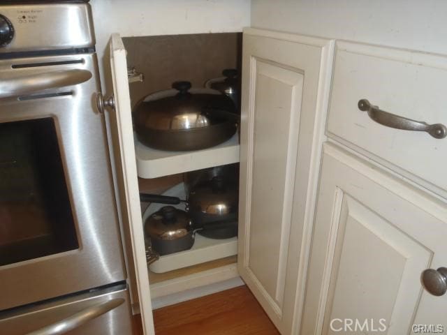 11459 Shippigan Way, Cypress, CA 90630 - laundry room featuring wood finished floors