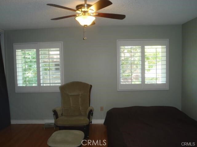 11459 Shippigan Way, Cypress, CA 90630 - bedroom with multiple windows, wood finished floors, and baseboards