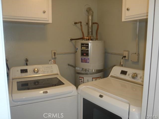 11459 Shippigan Way, Cypress, CA 90630 - washroom featuring water heater, washing machine and clothes dryer, and cabinet space