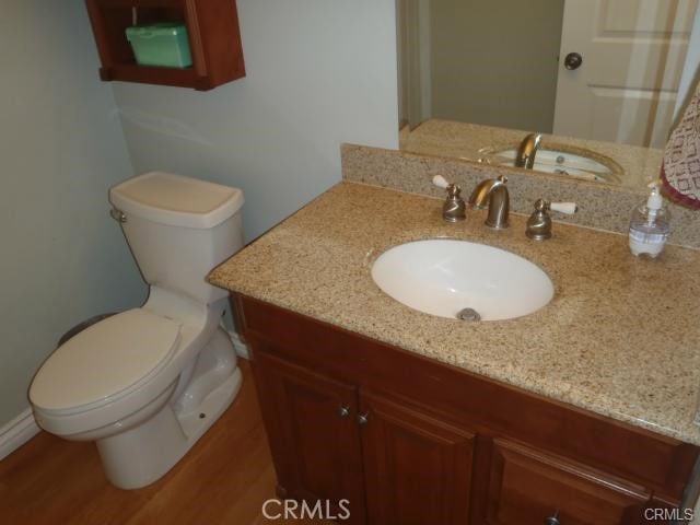 11459 Shippigan Way, Cypress, CA 90630 - bathroom featuring vanity and wood finished floors