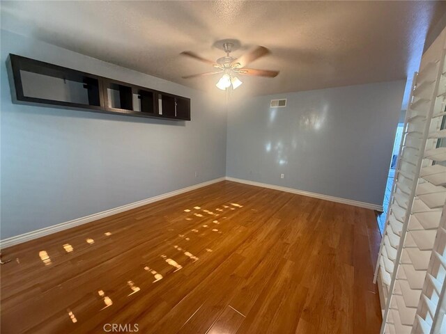 11459 Shippigan Way, Cypress, CA 90630 - spare room featuring a ceiling fan and wood finished floors