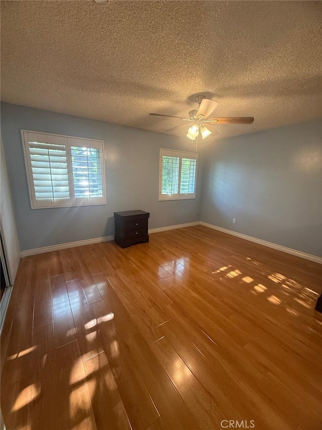 11459 Shippigan Way, Cypress, CA 90630 - unfurnished room featuring wood-type flooring, a textured ceiling, and a ceiling fan