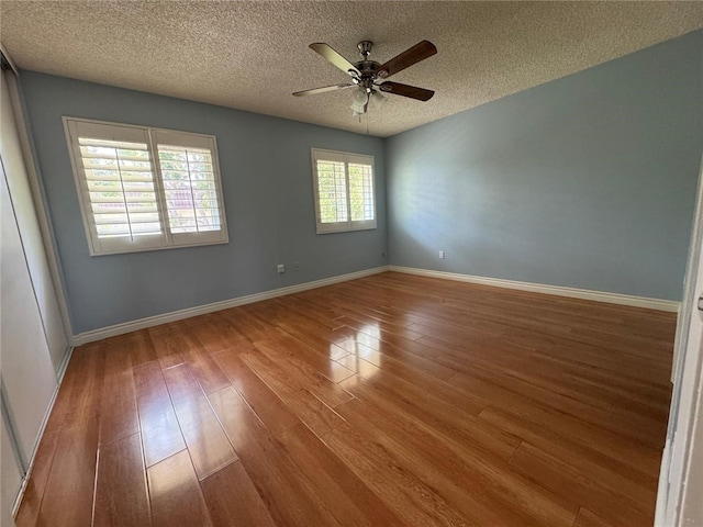 11459 Shippigan Way, Cypress, CA 90630 - empty room with a textured ceiling, wood finished floors, and ceiling fan
