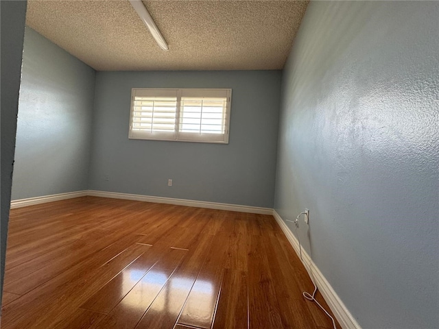 11459 Shippigan Way, Cypress, CA 90630 - empty room featuring hardwood / wood-style floors and a textured ceiling