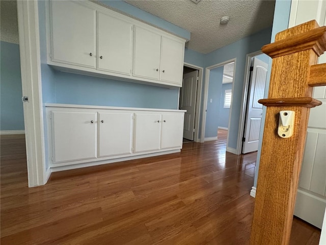 11459 Shippigan Way, Cypress, CA 90630 - kitchen featuring white cabinets, a textured ceiling, and wood finished floors