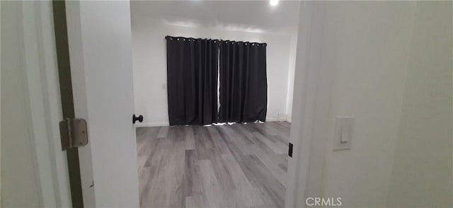 8814 Knollwood Pl, Rancho Cucamonga, CA 91730 - spare room with wood finished floors and radiator