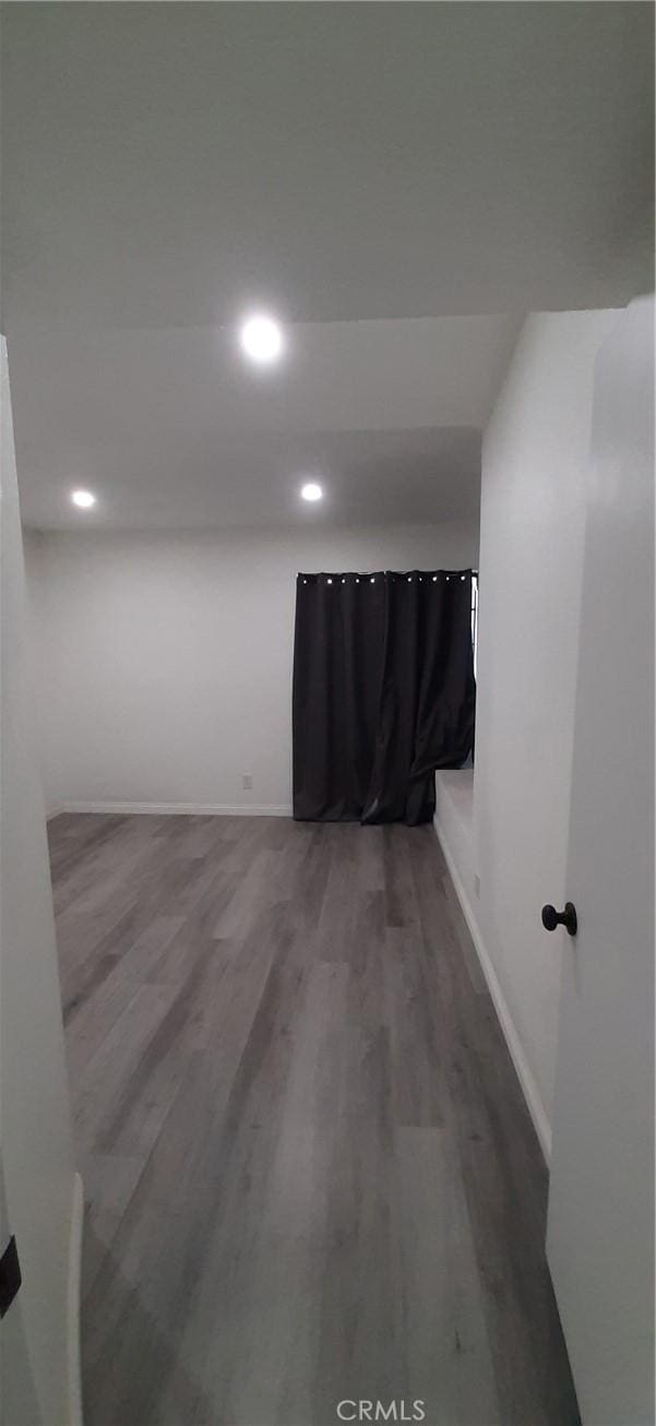 8814 Knollwood Pl, Rancho Cucamonga, CA 91730 - unfurnished room with wood finished floors, recessed lighting, and baseboards